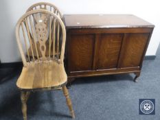 An oak blanket chest and a pair of oak wheel back chairs