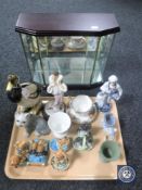 A glazed curio cabinet and a tray of figures, Pendelfin rabbits, jasper ware,