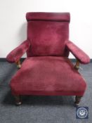 A Victorian mahogany armchair in red fabric