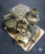 A tray of 20th century brass ware including an oil lamp base, brass trivet, watering can,