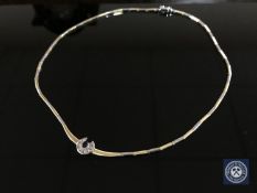 An 18ct white and yellow gold diamond and sapphire set necklace,