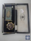 A cased silver Freemasons medal