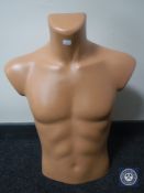 A male mannequin torso