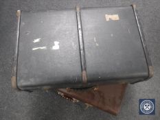 A vintage leather luggage case and a travelling trunk