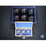 A box containing six composite bowls together with a case of French boules