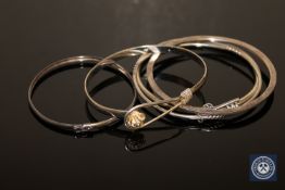 Three sterling silver and two white metal bangles (5)