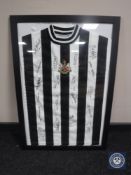 A singed framed NUFC vintage football shirt CONDITION REPORT: These are genuine