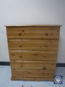 A pine five drawer chest