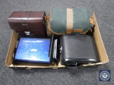 A box containing Beatles LP, Hitachi video camera, Zenit camera, binoculars,