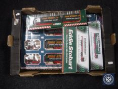 A box containing boxed Corgi and Atlas die cast vehicles,