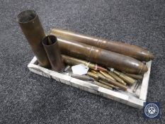 A tray of ammunition shells and bullet casings