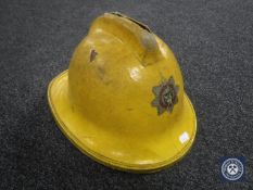 A vintage Cumbria Fire Service helmet