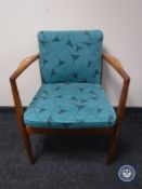 A mid 20th century teak armchair