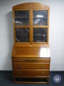 An early 20th century oak bureau bookcase