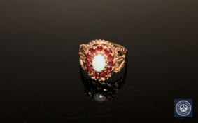 A 9ct gold garnet and opal cluster ring, size N/O CONDITION REPORT: 3.