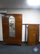 An Edwardian inlaid oak wardrobe and headboard, together with an oak four drawer bedroom chest,