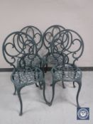 Four cast metal garden chairs