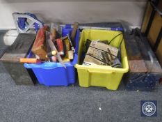 A metal ammo box and tool box of hand tools, two plastic crates of hand tools, bench vice,