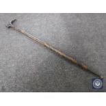 A sword stick in carved wooden sheath CONDITION REPORT: Generally in good condition.