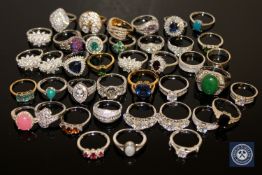 A collection of forty silver dress rings, variously set with tourmaline,