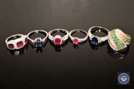 Three silver ruby dress rings,