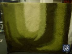 Two woollen carpets with green swirl pattern