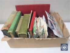 A box of stamp albums, loose stamps, cigarette cards, handkerchiefs,