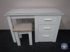 A contemporary painted dressing table fitted three drawers with stool