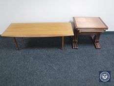 A mid 20th century teak coffee table and a nest of three G Plan copper topped tables