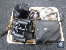 A tray of British coins, crowns, two sets of cased binoculars,