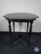 A Victorian octagonal ebonised occasional table