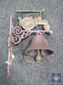 A cast iron traction engine wall bracket with bell