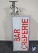 A French illuminated 'Bar Creperie' sign