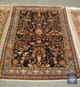 An antique Persian Farahan rug, 192 cm x 134 cm.