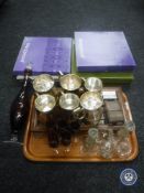 A tray of plated tankards, glass ware, thimble stands, thimbles, five boxed Wedgwood plates,