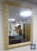 A gilt framed contemporary overmantel mirror