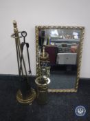 Two brass companion sets and a gilt framed mirror