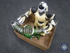 A box of two Robotic toys with hand sets