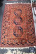Turkmen rug, North Afghanistan, the terracotta field with three elephant foot guls,