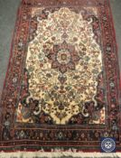 A Persian Bidjar rug, 175 cm x 112 cm.