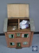 A mid 20th century doll's house with accessories