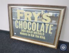 A gilt and silvered framed mirror bearing Fry's Chocolate advertisement