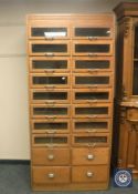 An early twentieth century twenty drawer haberdashery chest, height 198 cm.