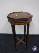 A Victorian inlaid octagonal plant stand with pull out slide
