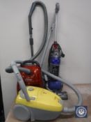 A Dyson 24 ball vacuum cleaner and two cylinder vacuum cleaners