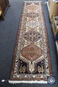 A Persian design runner on blue ground,