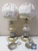 A pair of Victorian glass and metal table lamps with shades and hand painted decoration