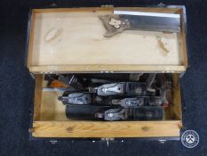 A joiner's tool box of six assorted Stanley planes and hand saws
