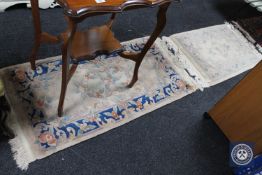 A Chinese rug on cream ground,