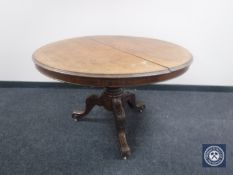 A circular Victorian mahogany breakfast table